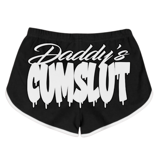 Bold and provocative VEGAS STYLE booty shorts featuring the text "Daddy's Cumslut" in a graffiti-inspired font against a black background.