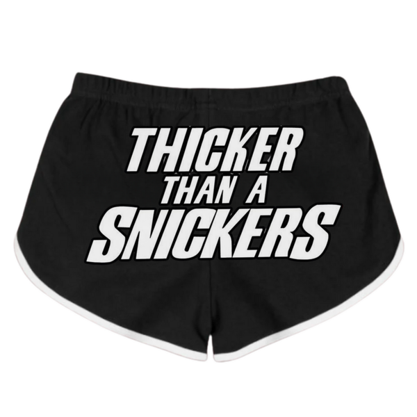 Black booty shorts with bold white text "THICKER THAN A SNICKERS" printed in the center.